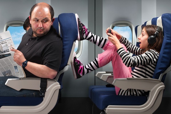 children kicking back of seat