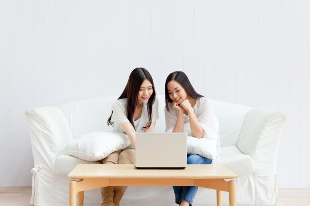 Women Using A Laptop Computer