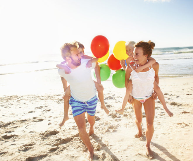 Family playing on beach