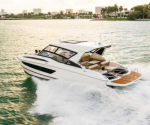 The Aquila 32 features a swim platform that wraps around the outboards