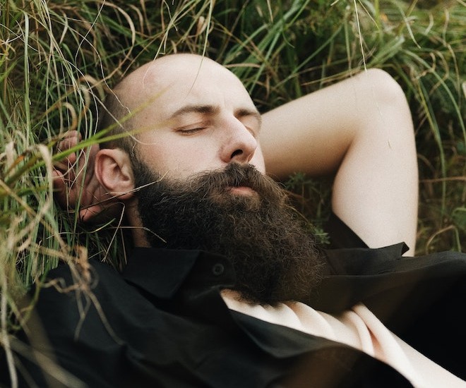 man laying on the grass