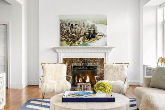 A cosy, luxe fire place at Cher's home.