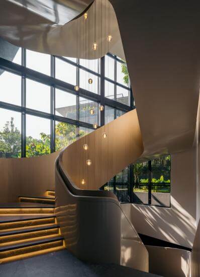Bocci pendant lights add pizzazz to the modern spiral staircase