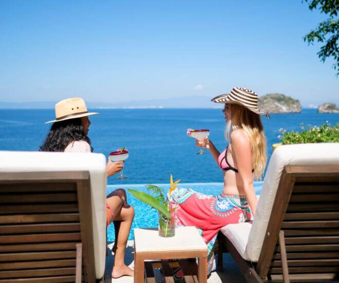 Ladies enjoying margaritas at a luxurious villa in Puerto Vallarta