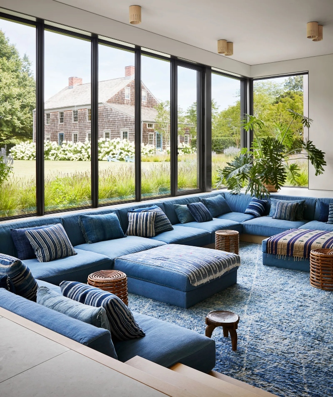 The sunken lounge inside this East Hampton compound is outfitted with a custom sofa system covered in Japanese denim. Photo: Stephen Kent Johnson