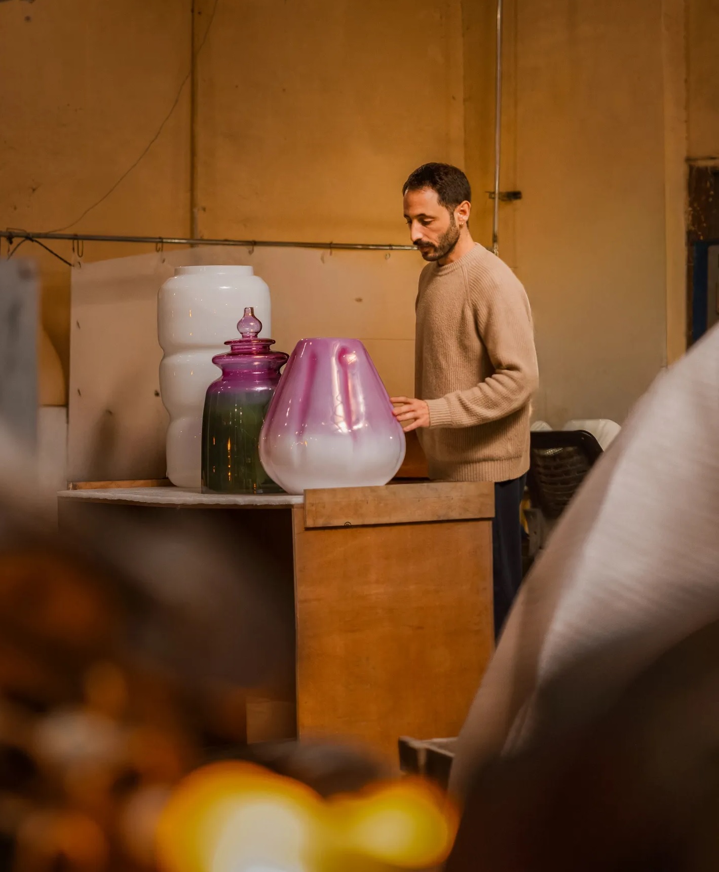 Garber at Klove Studio, working with handblown glass forms developed during the residency. Image: Deepak Bhatia.