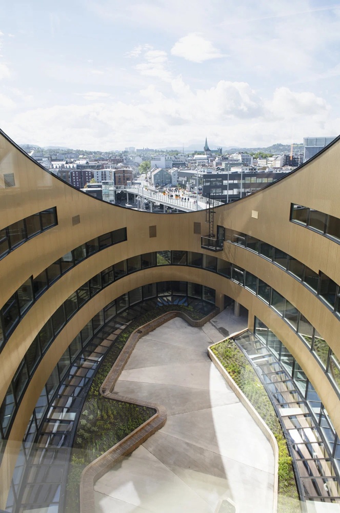 The outdoor atrium space of Snøhetta's Powerhouse Brattørkaia in Trondheim, Norway. Image: Ivar Kvaal